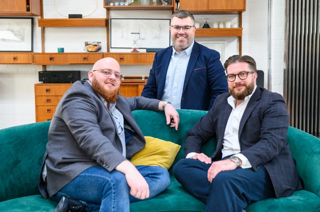 Adfluential team on a green sofa